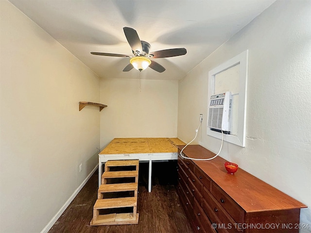 unfurnished dining area featuring ceiling fan and dark hardwood / wood-style floors