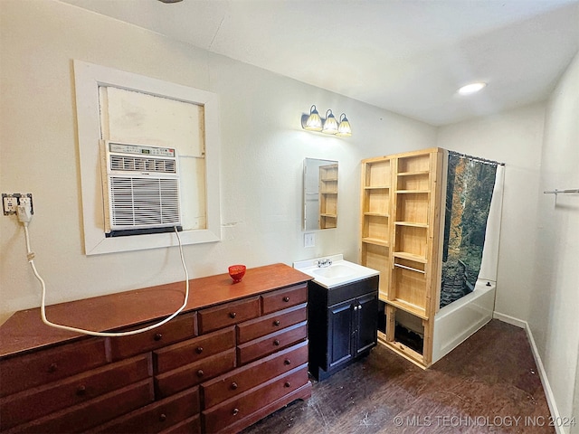 bathroom with wood-type flooring, vanity, and shower / bathtub combination with curtain