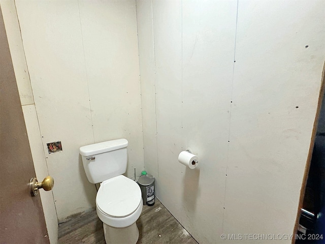 bathroom with wood-type flooring and toilet