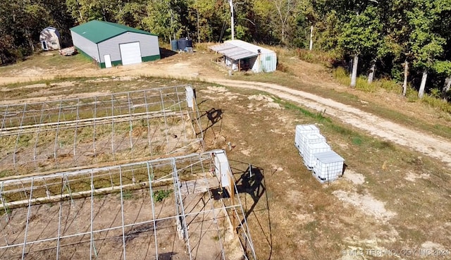 birds eye view of property featuring a rural view