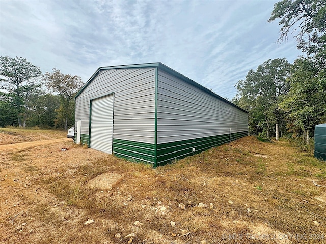 view of outbuilding with a garage