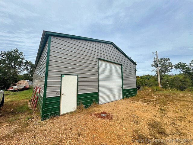 view of outbuilding featuring a garage