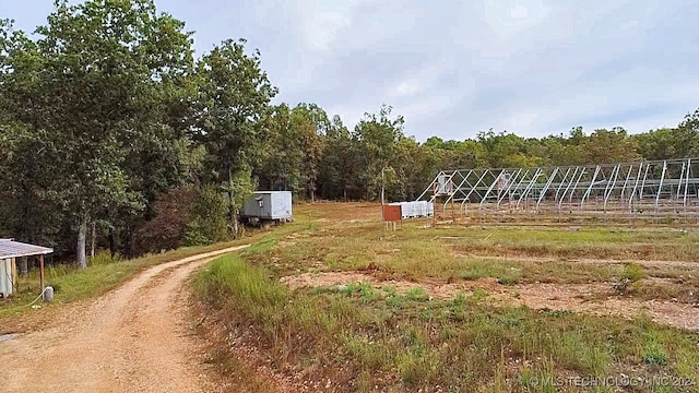 view of yard with a rural view