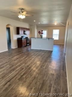 interior space with dark hardwood / wood-style floors and ceiling fan