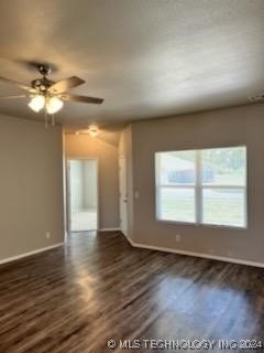 interior space featuring dark hardwood / wood-style floors and ceiling fan