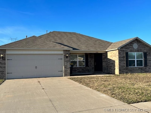 single story home featuring a garage