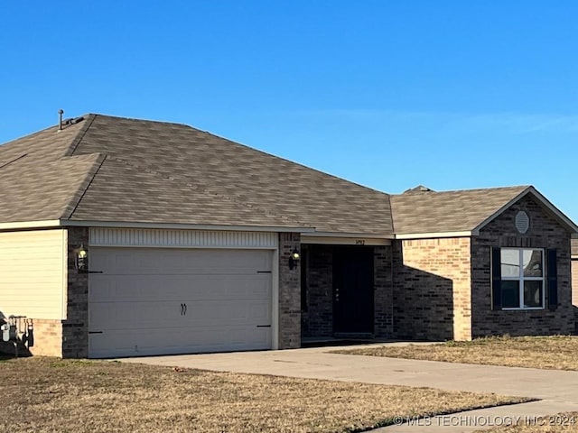 ranch-style house featuring a garage