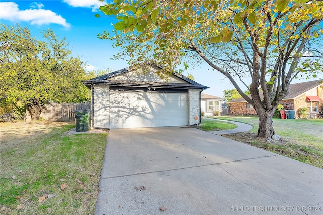 garage with a lawn