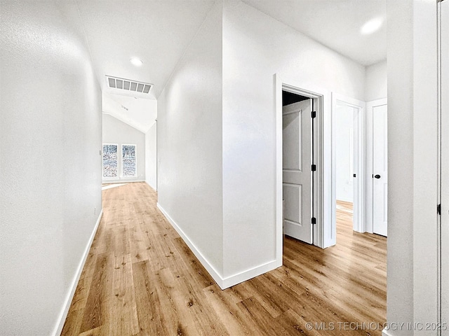 856 E Harlan Dr, Tahlequah, OK 74464 - hall featuring light wood-type flooring, baseboards, vaulted ceiling, and recessed lighting
