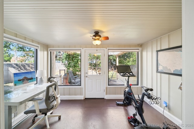 exercise room with ceiling fan