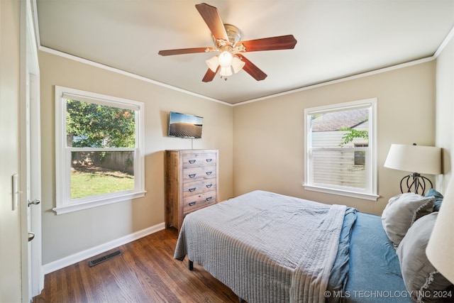 bedroom featuring ceiling fan, crown molding, dark hardwood / wood-style flooring, and multiple windows