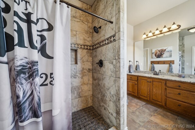 3691 E 390th Rd, Oologah, OK 74053 - bathroom featuring tiled shower and vanity