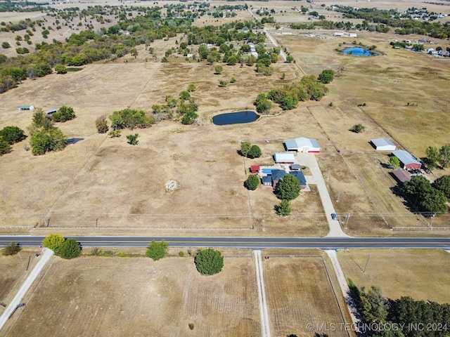 birds eye view of property featuring a rural view