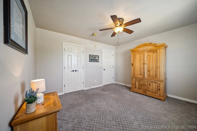 carpeted bedroom featuring ceiling fan