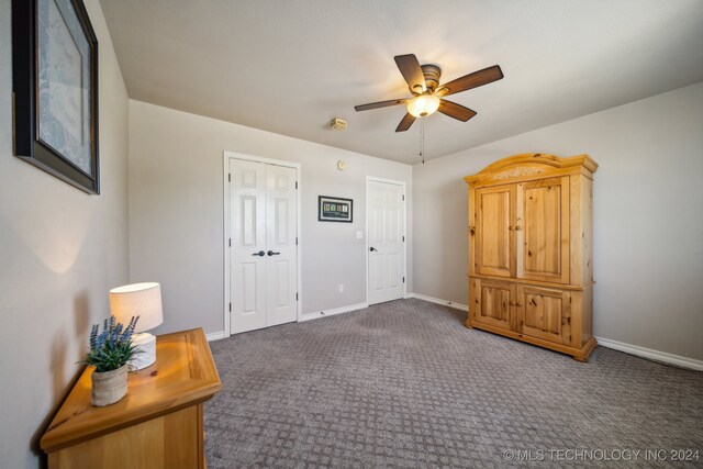 3691 E 390th Rd, Oologah, OK 74053 - unfurnished bedroom with baseboards, carpet flooring, and a ceiling fan