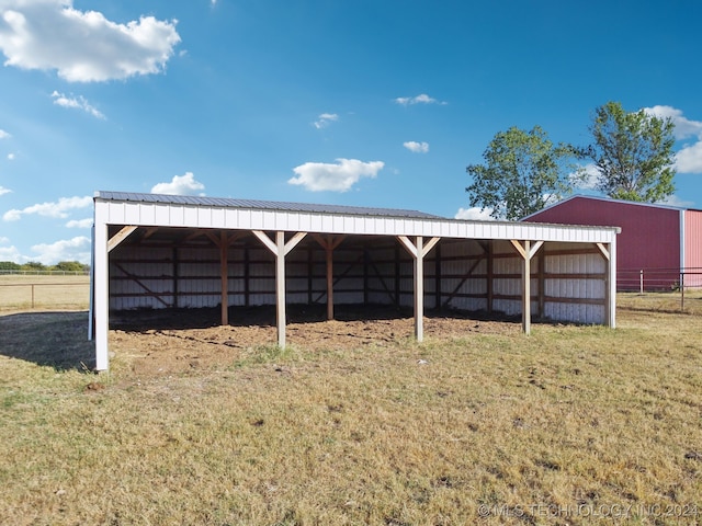 view of outdoor structure featuring a lawn