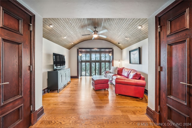 living room featuring ceiling fan, light wood-type flooring, lofted ceiling, and wooden ceiling