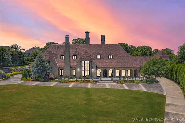 view of front of home with a lawn