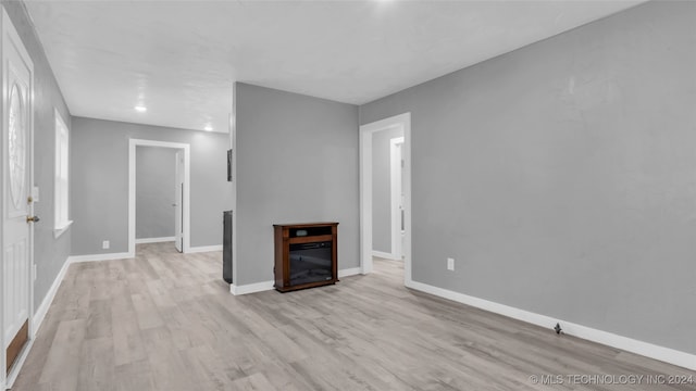 unfurnished living room with light hardwood / wood-style floors