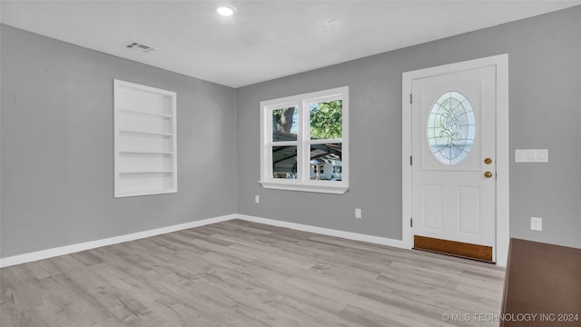 foyer entrance with light hardwood / wood-style flooring