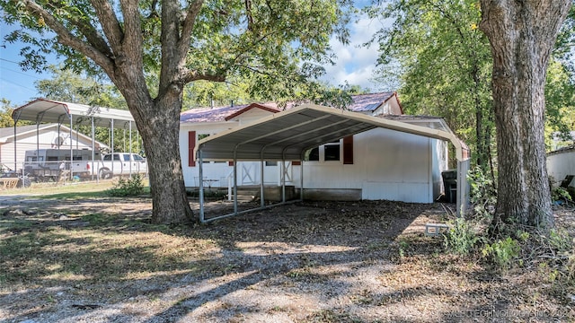 exterior space featuring a carport