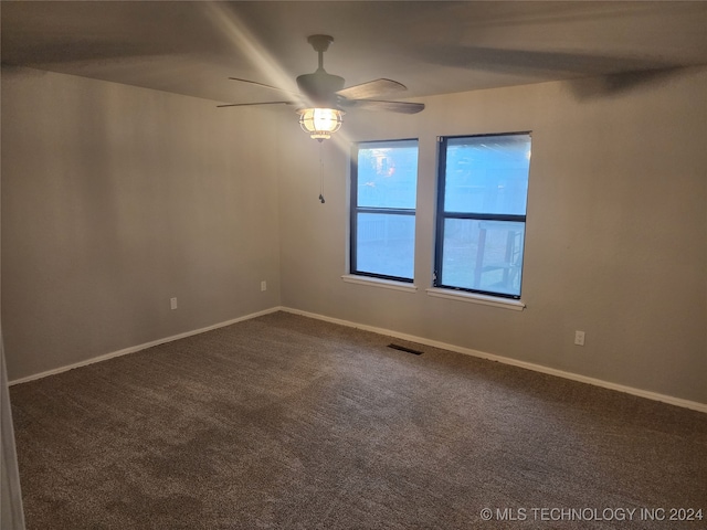 carpeted empty room with ceiling fan