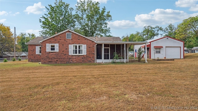 view of front facade with a sunroom and a front lawn