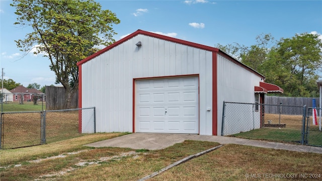 garage featuring a yard