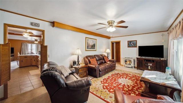 living room with light tile patterned flooring and crown molding