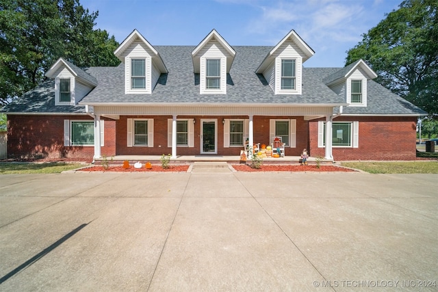 cape cod home with covered porch