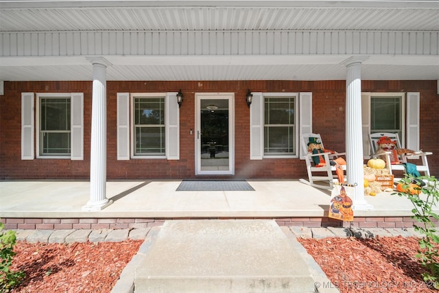 entrance to property featuring a porch