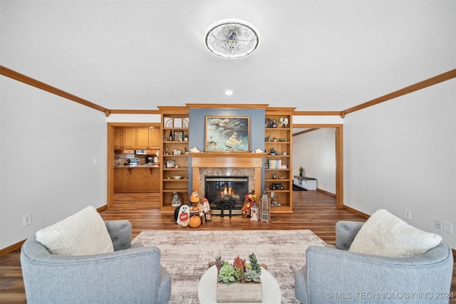 living room with crown molding, dark hardwood / wood-style flooring, and a high end fireplace