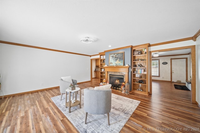 living room with crown molding and hardwood / wood-style flooring