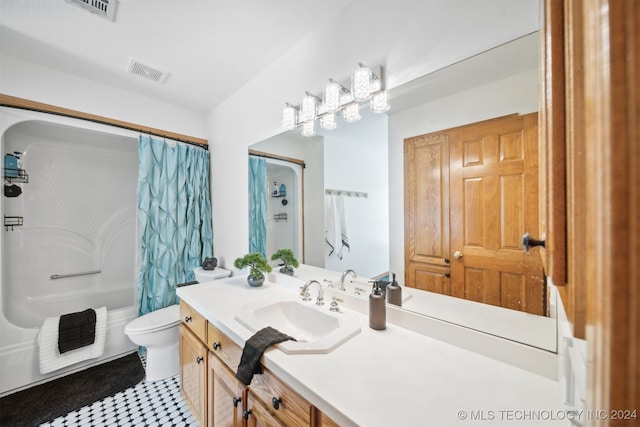 full bathroom featuring vanity, shower / tub combo, toilet, and tile patterned flooring