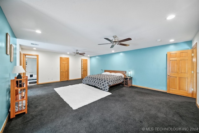 bedroom featuring ceiling fan and dark colored carpet