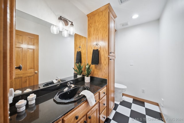 bathroom with vanity and toilet