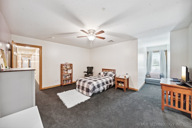 bedroom featuring dark carpet and ceiling fan