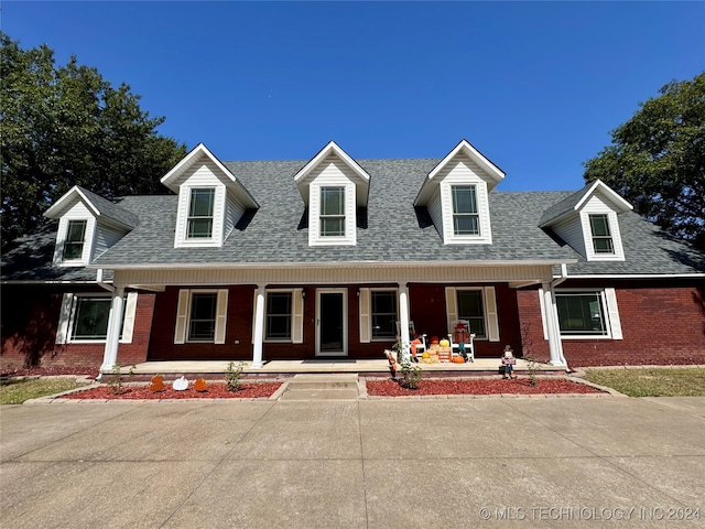 cape cod house with covered porch