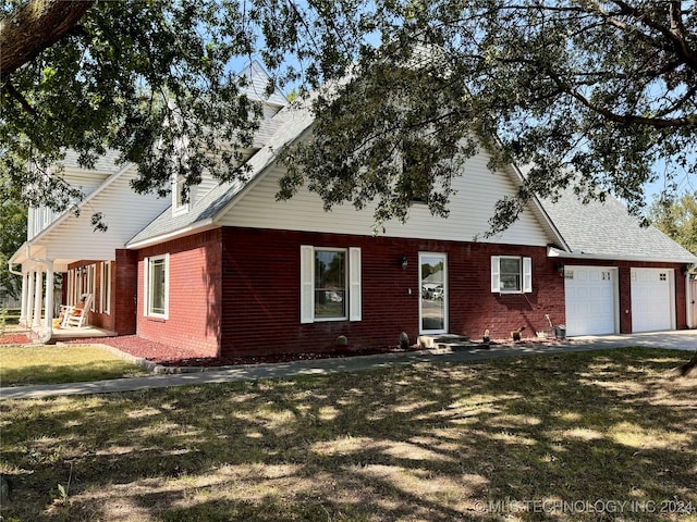 view of front facade with a garage and a front lawn