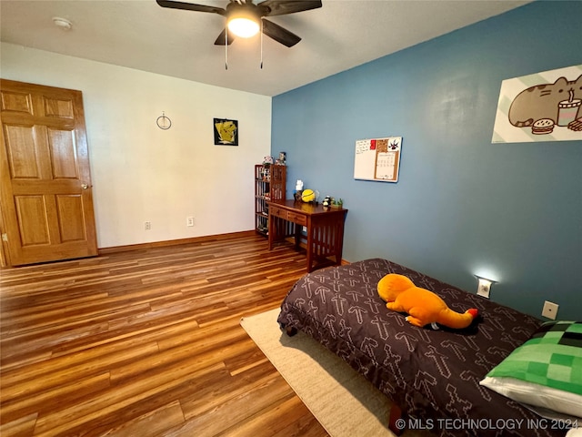 bedroom featuring wood-type flooring and ceiling fan