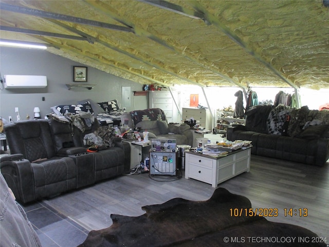 living room featuring vaulted ceiling and hardwood / wood-style floors