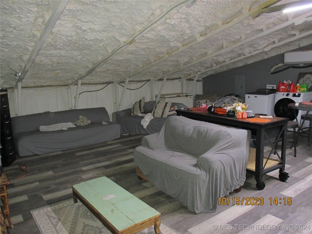 basement with hardwood / wood-style flooring and washer and clothes dryer