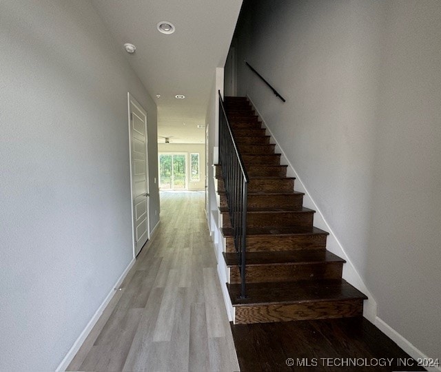 staircase featuring hardwood / wood-style flooring