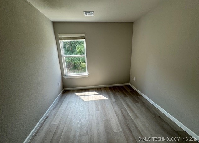 spare room with light wood-type flooring