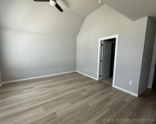 bonus room with light wood-type flooring, lofted ceiling, and ceiling fan