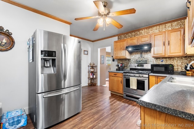 kitchen featuring sink, backsplash, dark hardwood / wood-style flooring, stainless steel appliances, and crown molding