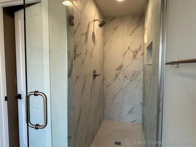 bathroom featuring a shower stall