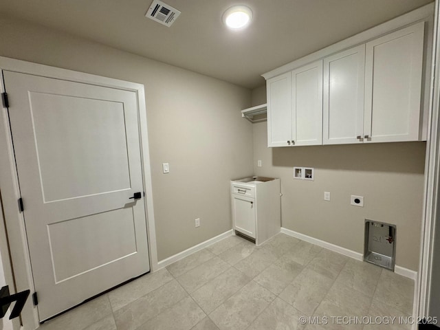 washroom with washer hookup, visible vents, cabinet space, electric dryer hookup, and baseboards