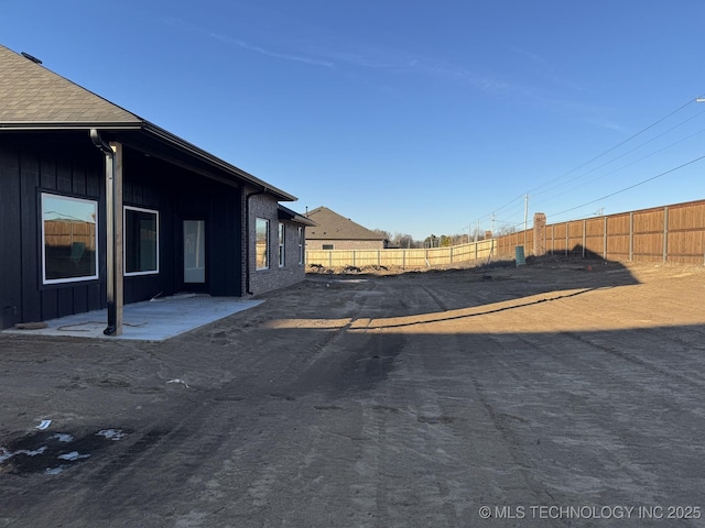 view of yard featuring a patio area and fence