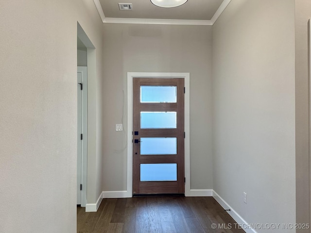 foyer with ornamental molding and dark wood-type flooring